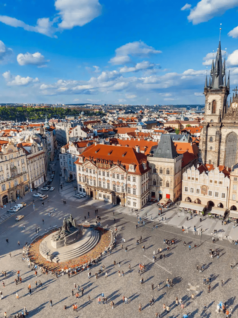 Scenic view of Old Town square in Prague with historic architecture and vibrant city atmosphere.