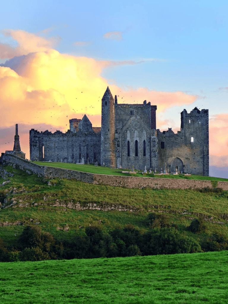 Ancient Scottish castle on a hill at sunset, scenic historic landmark, travel destination, Quest for Directions.