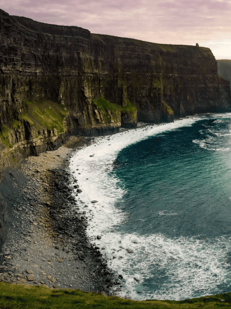 Stunning Cliffs and Coastal View with Waves at the base, scenic ocean landscape for travel inspiration.