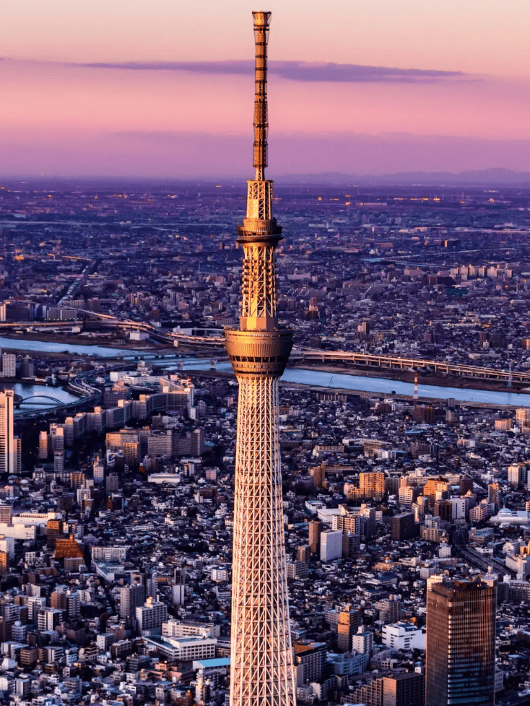 Tokyo Skytree illuminated at sunset, Japan's iconic broadcasting tower and landmark.