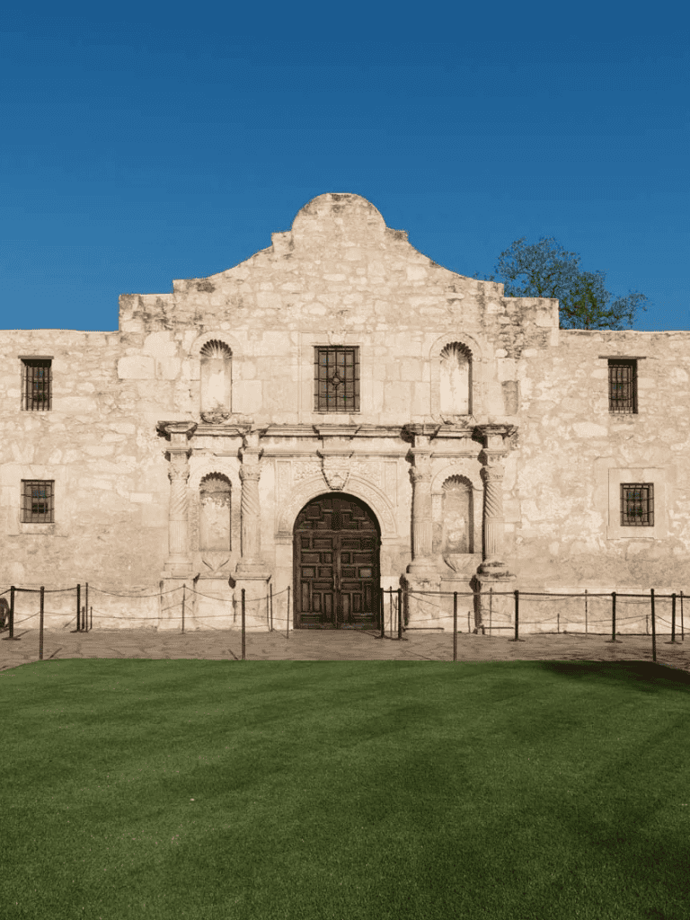 Ancient mission church with historic architecture and well-preserved stone facade in Texas.