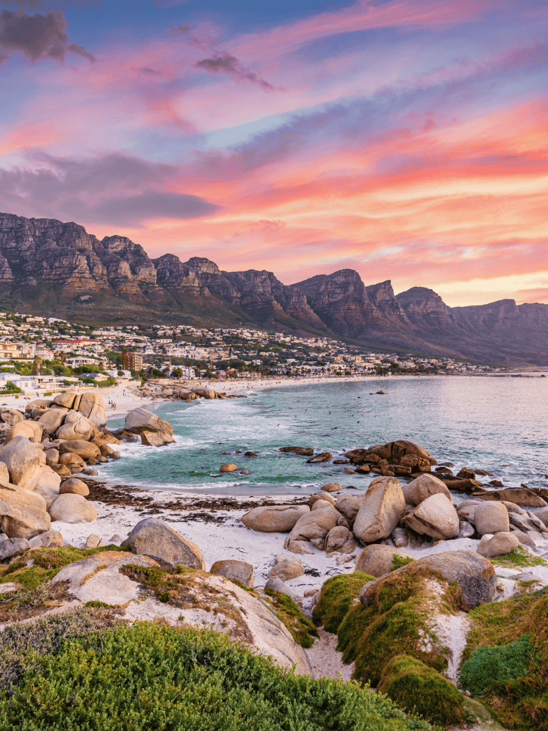 Stunning Cape Town coastline with Table Mountain at sunset, best reviews for travel and tourist destinations.