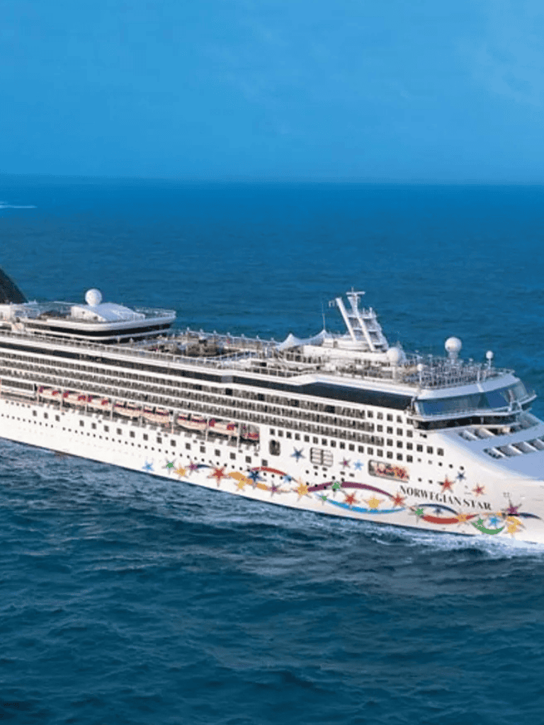 Luxury cruise ship sailing in open sea for vacation travel and maritime adventures.