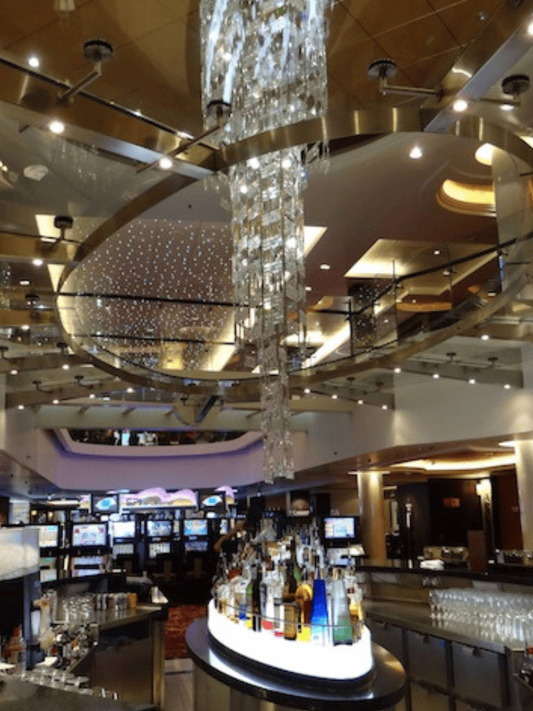 Elegant hotel lobby with luxurious chandeliers and modern decor, offering a sophisticated ambiance.