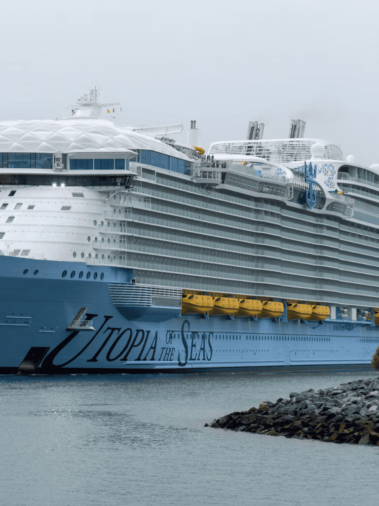 Luxurious cruise ship Utopia of the Seas docked at port, offering unforgettable travel adventures.