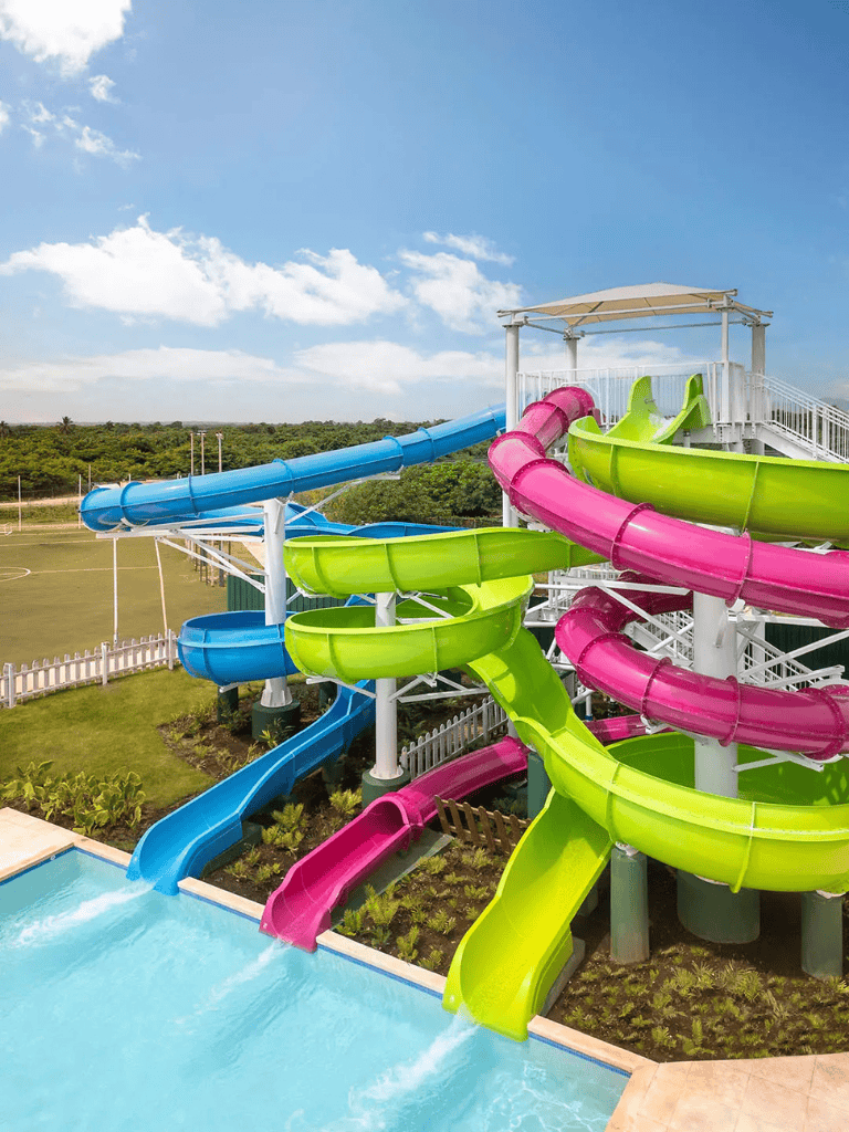 Colorful water slides at QuestForDirections outdoor water park, family fun and adventure, summer activity destination.