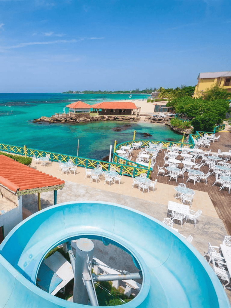 Beachside resort with water slides and ocean views, perfect for family vacations.