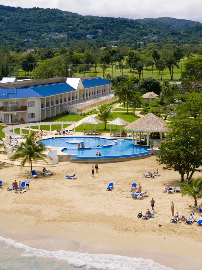 Oceanfront resort with swimming pool and beach access, perfect for tropical vacations and relaxation.