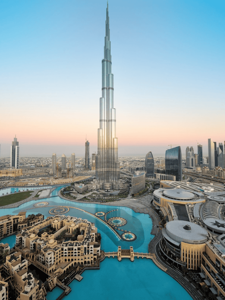 Burj Khalifa towering over Dubai skyline with luxury cityscape and water features.