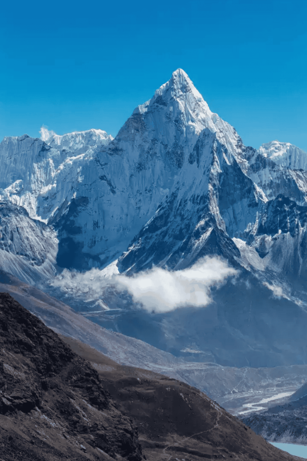 Majestic snow-capped mountain peak in the Himalayas with clear blue sky.