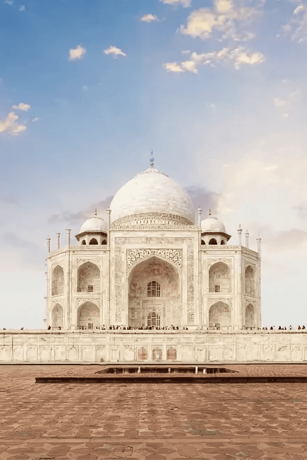Intricate view of the Taj Mahal, a world-famous monument in India, showcasing stunning white marble architecture and gardens.