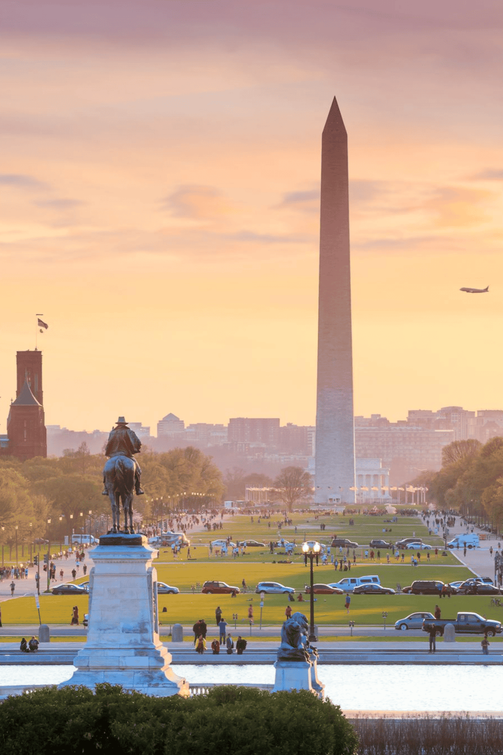 Historic Washington Monument and cityscape at sunset, showcasing popular tourist attractions and monuments in Washington, D.C.