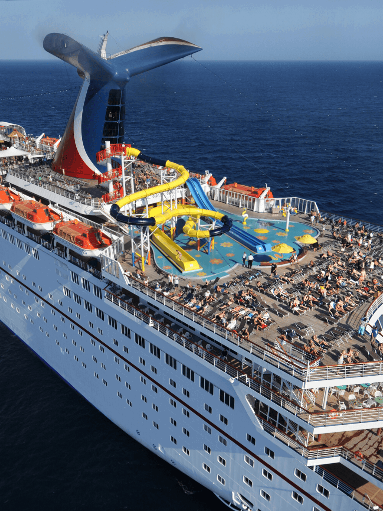 Cruise ship with water slides and ocean view, luxurious vacation on the sea.