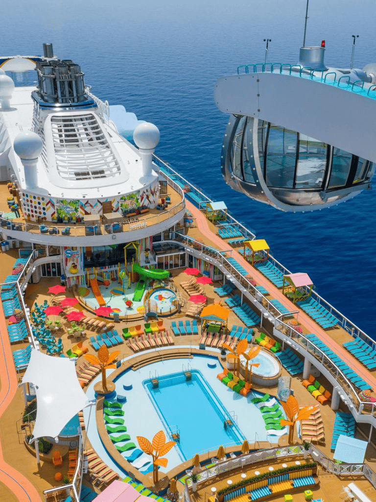 Colorful cruise ship deck with swimming pool and water slide, ocean view with sky Ferris wheel capsule on cruise ship.