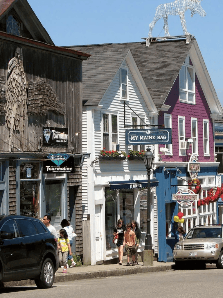 Colorful Main Street shops in Portland, Maine, with vibrant facades and local businesses.