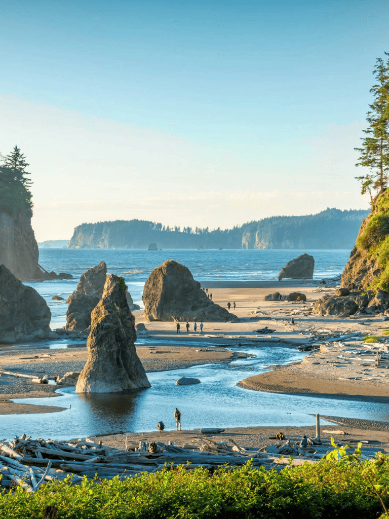 Stunning Oregon coastline with rock formations and tide pools at Cannon Beach.
