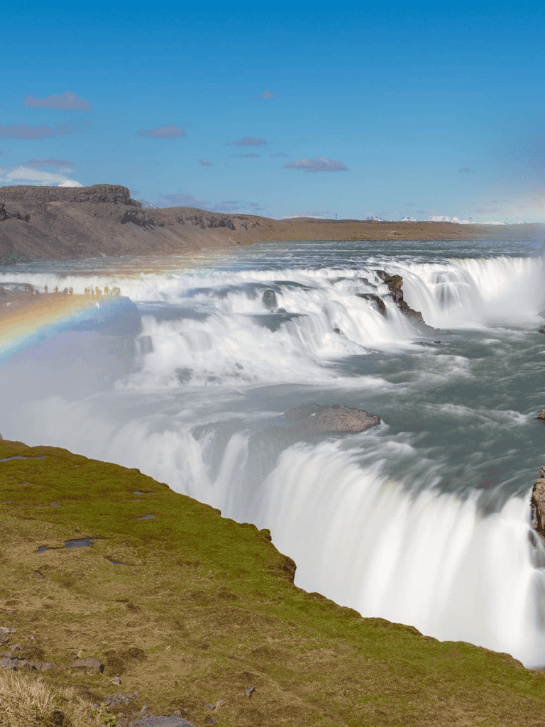 Spectacular waterfall scenic view, Iceland tourist destination, natural wonders travel, QuestForDirections.