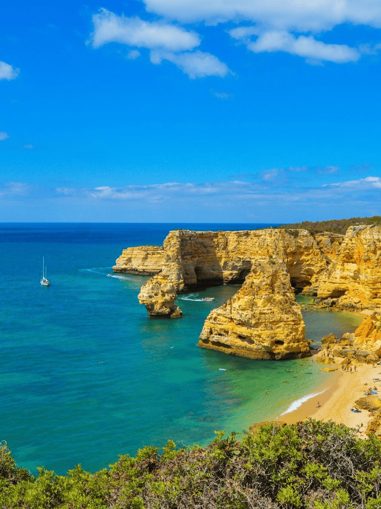 Stunning Algarve coastline with sea caves and golden cliffs in Portugal.