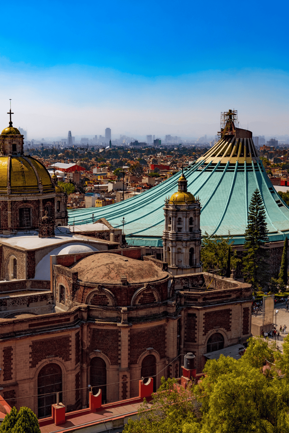 Historic Mexico City Cathedral with skyline view of downtown.