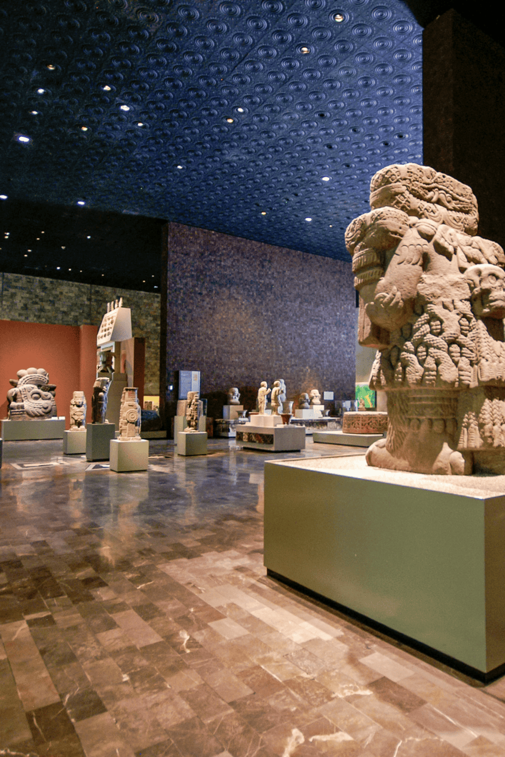Ancient Mesoamerican sculptures display at Quest for Directions cultural museum.