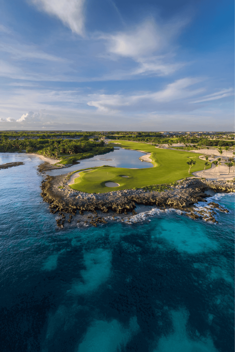Seaside golf course with scenic ocean views and lush green fairways.
