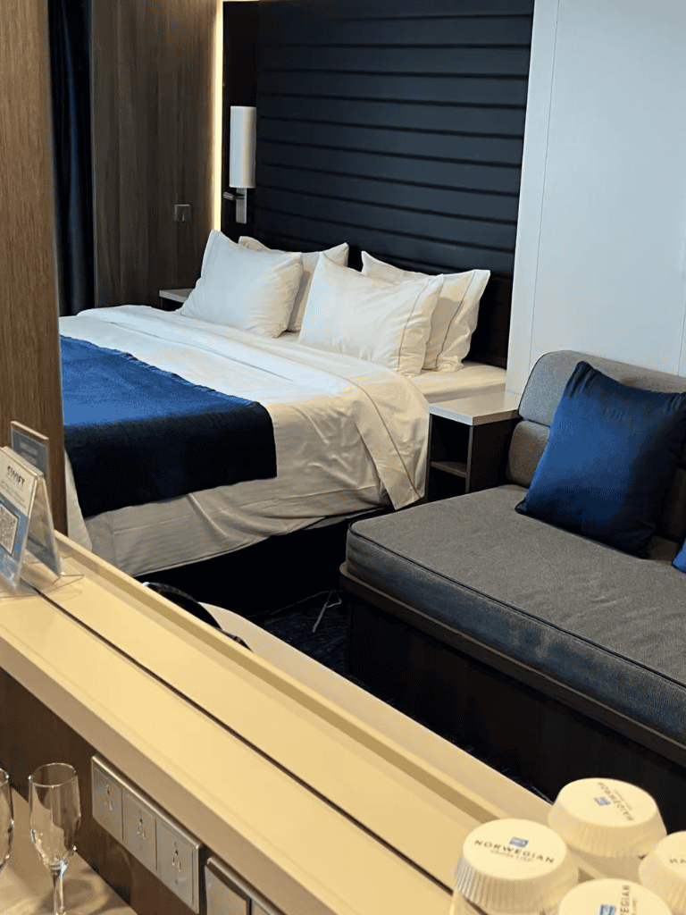 Modern hotel room with a comfortable bed and stylish decor, ideal for business and leisure travelers.