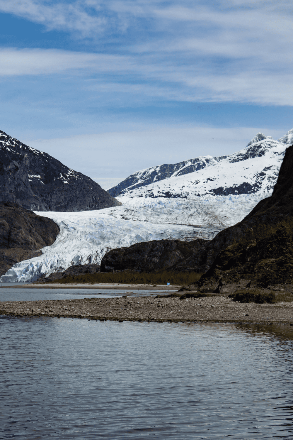 Snow-capped mountains and glacier in a scenic natural landscape, perfect for adventure travel and outdoor exploration.