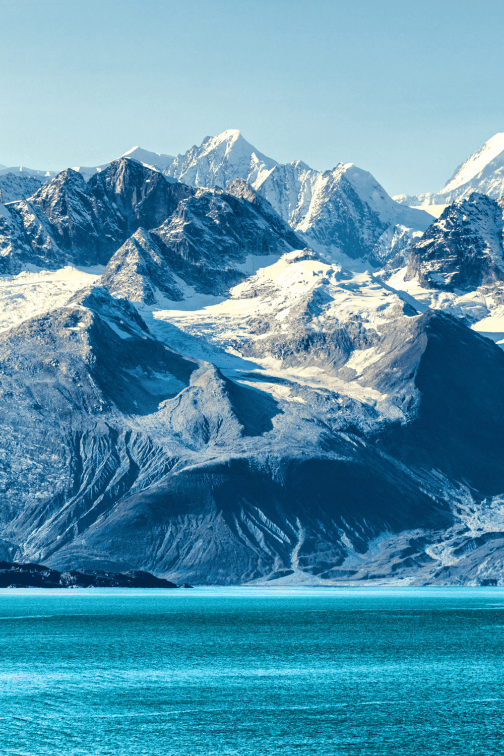 Snow-capped mountain range with glacier and turquoise lake, scenic natural landscape, travel destination, QuestForDirections.