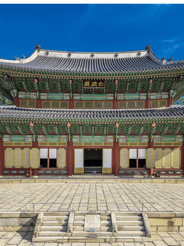Ancient Korean temple with vibrant traditional architecture and detailed roof design.