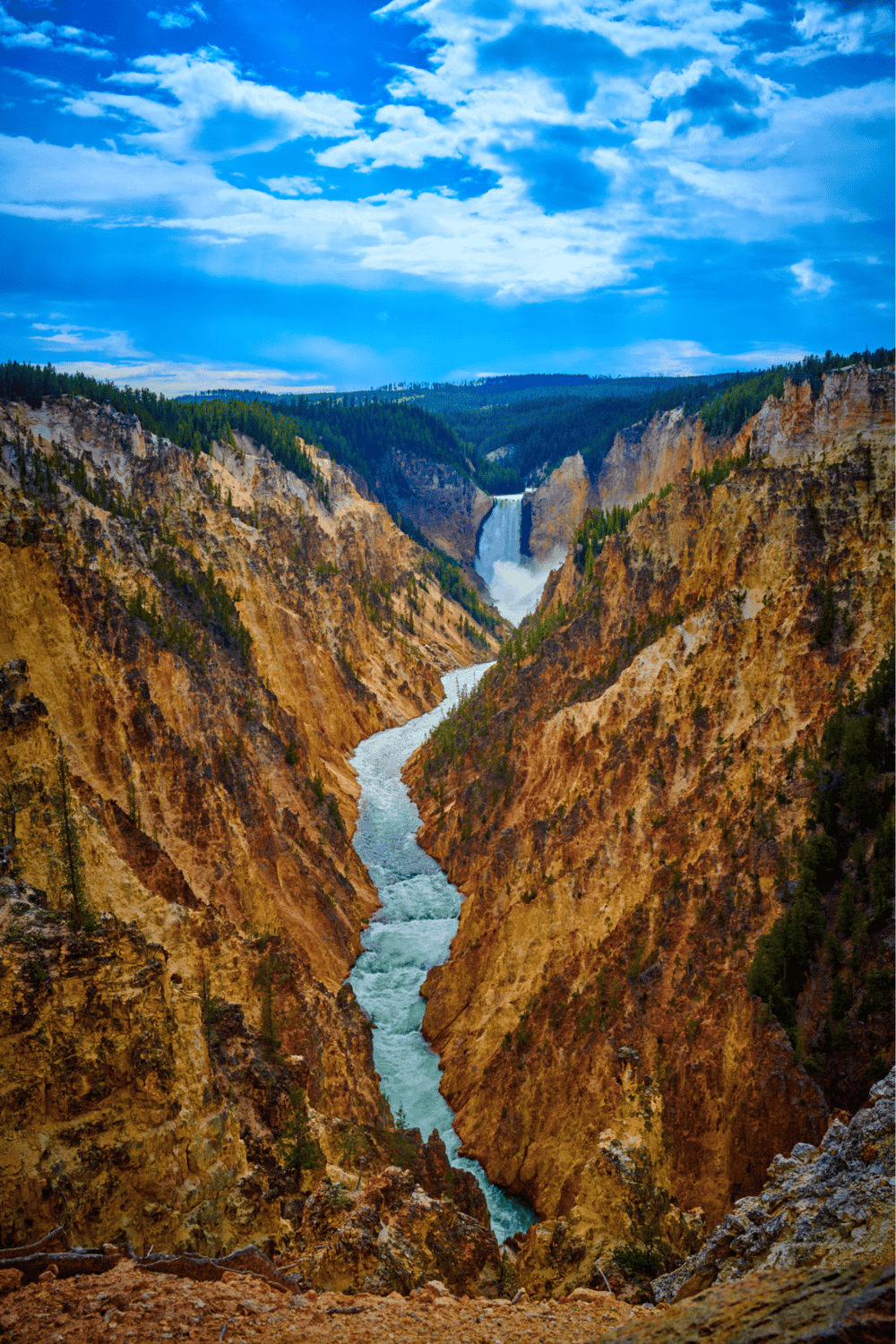 Vivid Yellowstone Grand Canyon with waterfalls and river, scenic view, outdoor adventure destination, symbol of natural beauty.