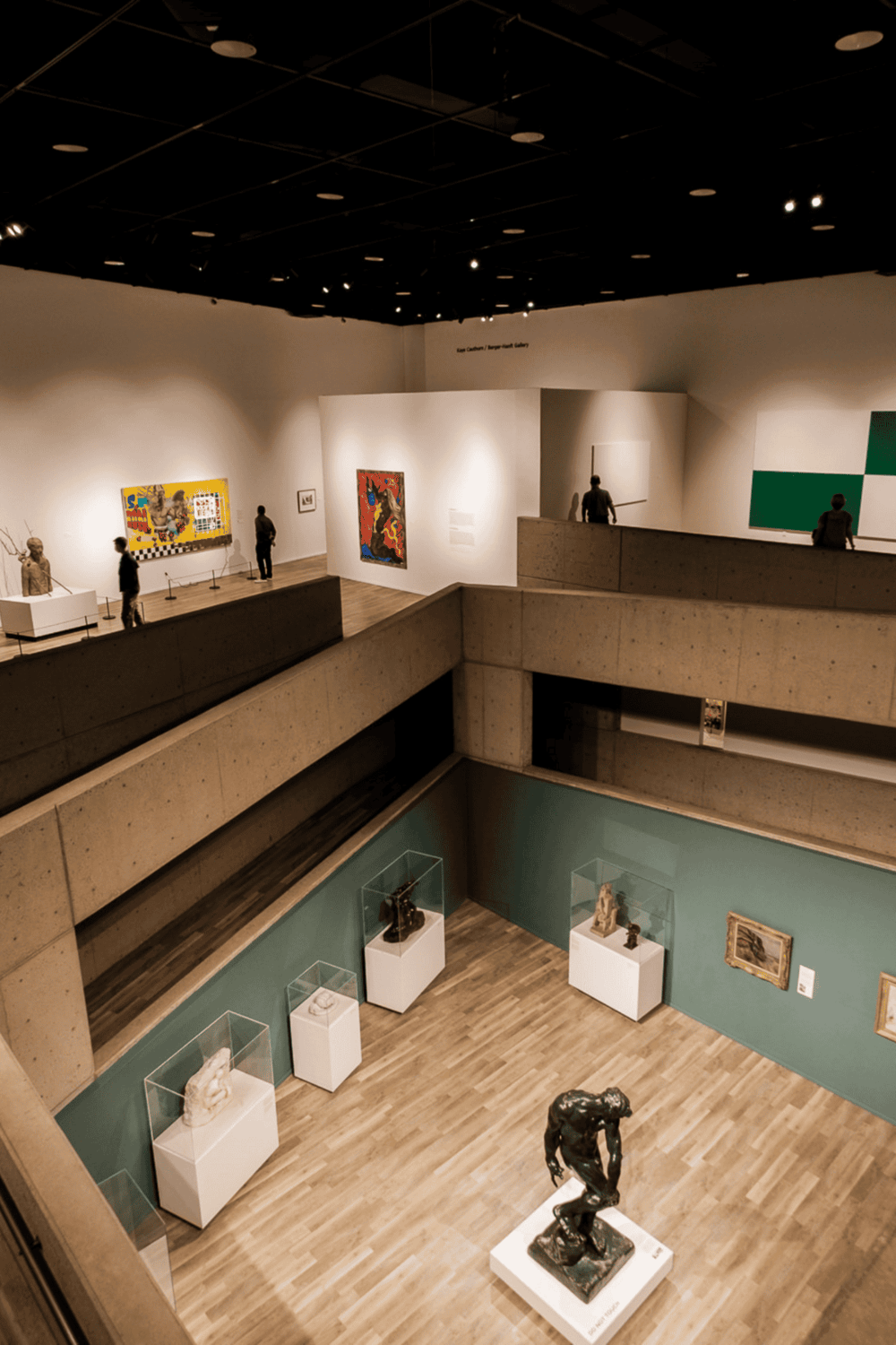 Colorful modern art gallery inside Museum of Fine Arts in Houston, featuring sculptures and paintings on display.