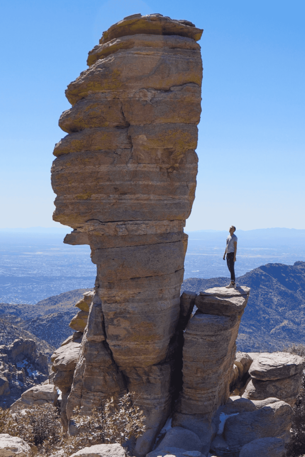 Aerial rock formation with a hiker in Joshua Tree National Park, California.