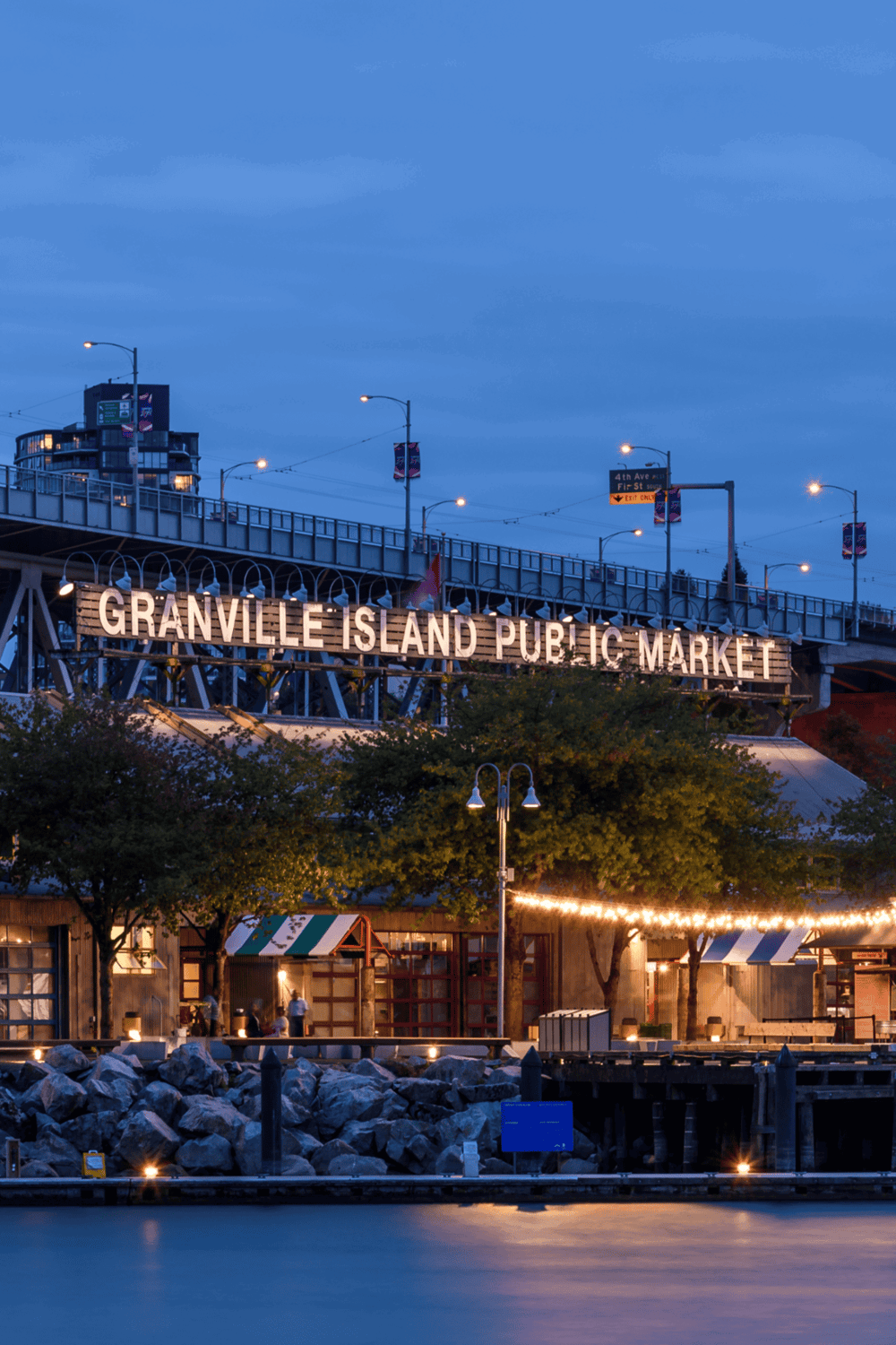 Cozy evening at Granville Island Public Market in Vancouver, vibrant waterfront shopping and dining spot.