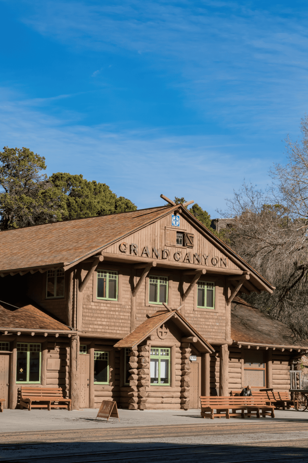 1. Rustic Grand Canyon train station building with wooden architecture and blue sky.