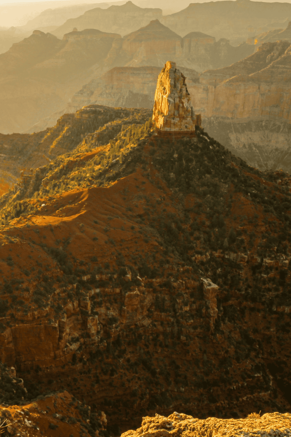 Majestic Grand Canyon rock formation during sunset, showcasing breathtaking natural beauty.