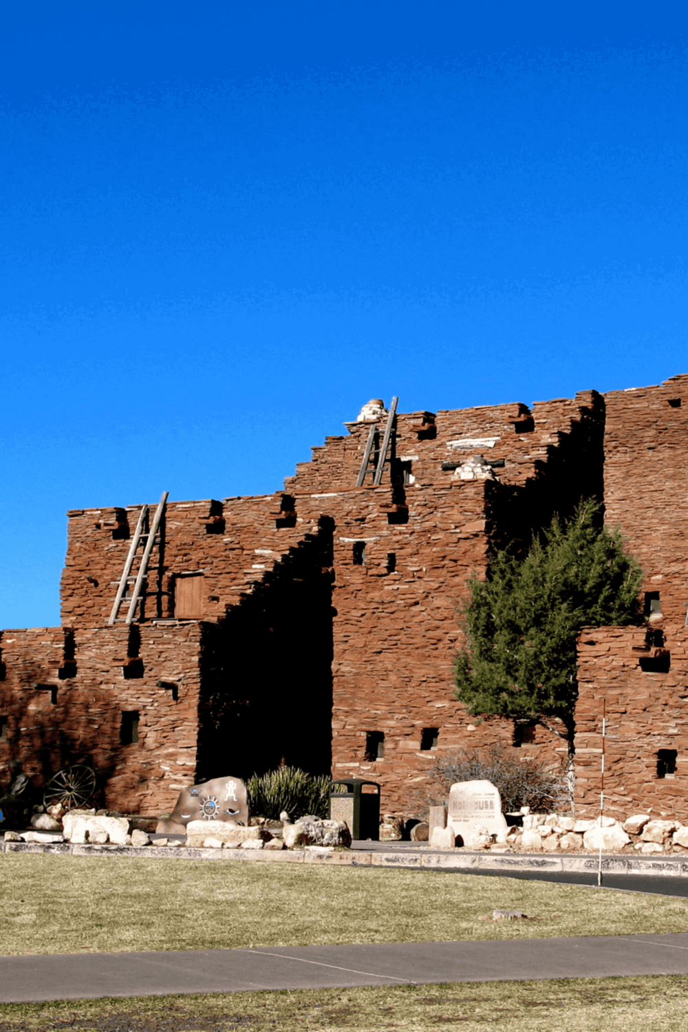 Ancient Ancestral Puebloan cliff dwellings at Cliff Palace, Colorado, with blue sky backdrop.