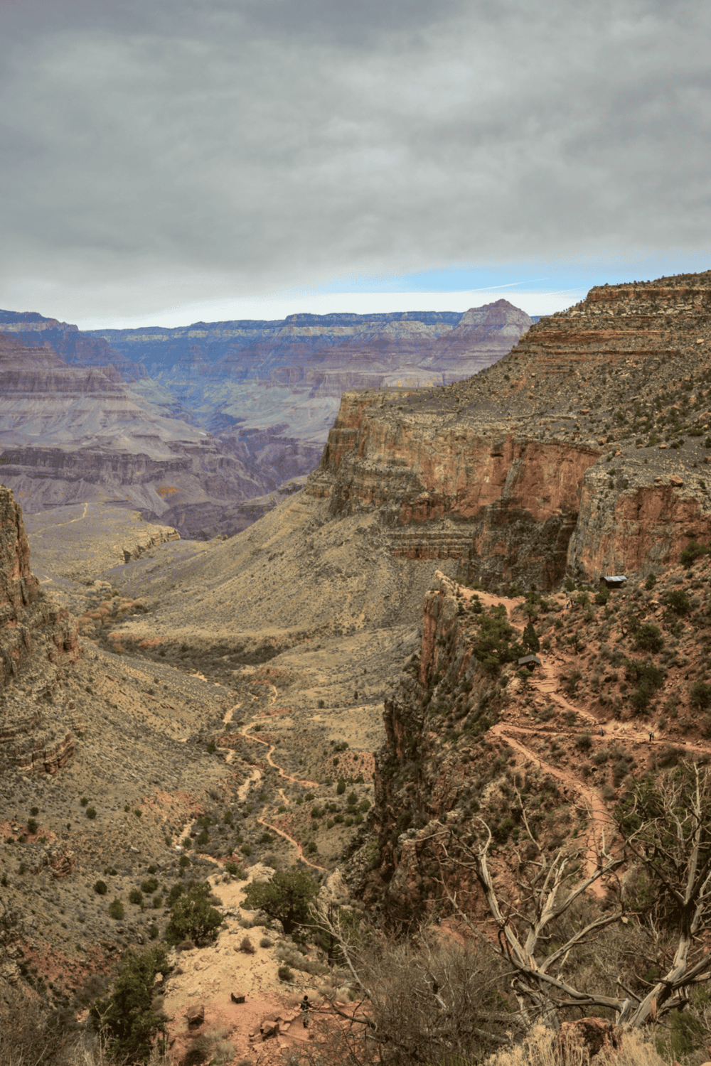 Vast Grand Canyon landscape with rugged cliffs and narrow trails, perfect for adventure and sightseeing.
