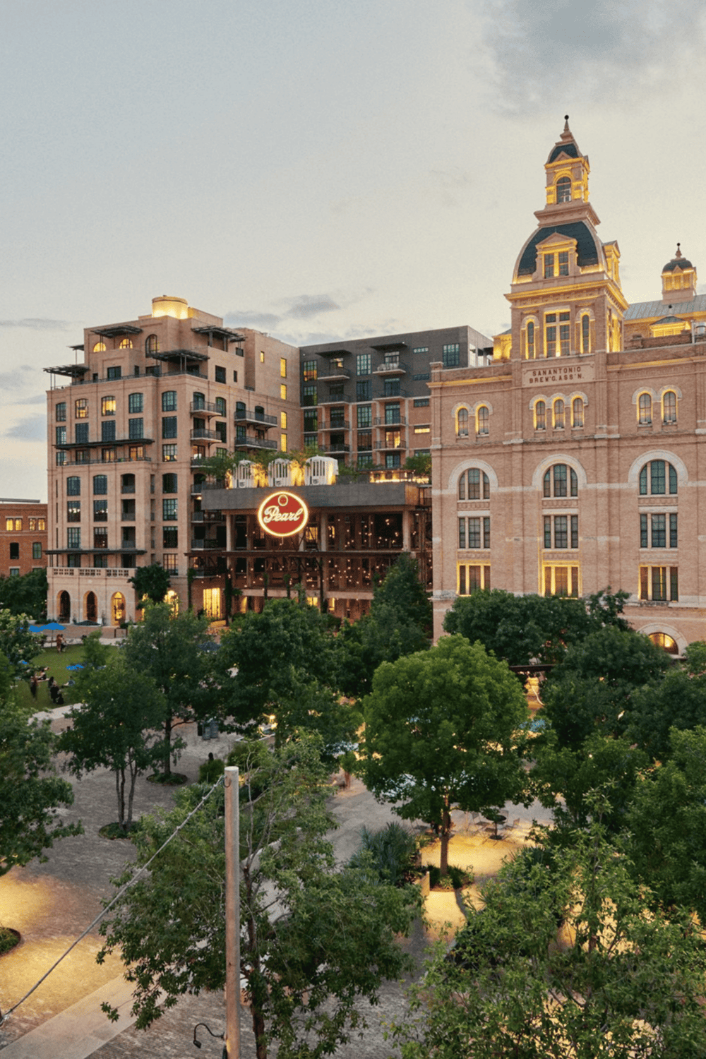 Historic downtown San Antonio with modern residential buildings and the Pearl sign.