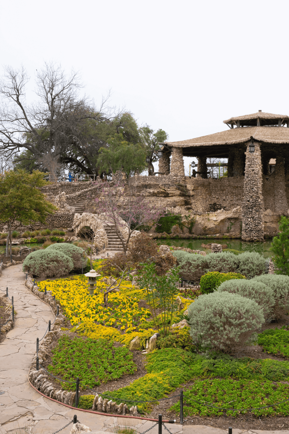 Serene garden at QuestForDirections, featuring stone structures and lush landscaping for navigation and outdoor relaxation.
