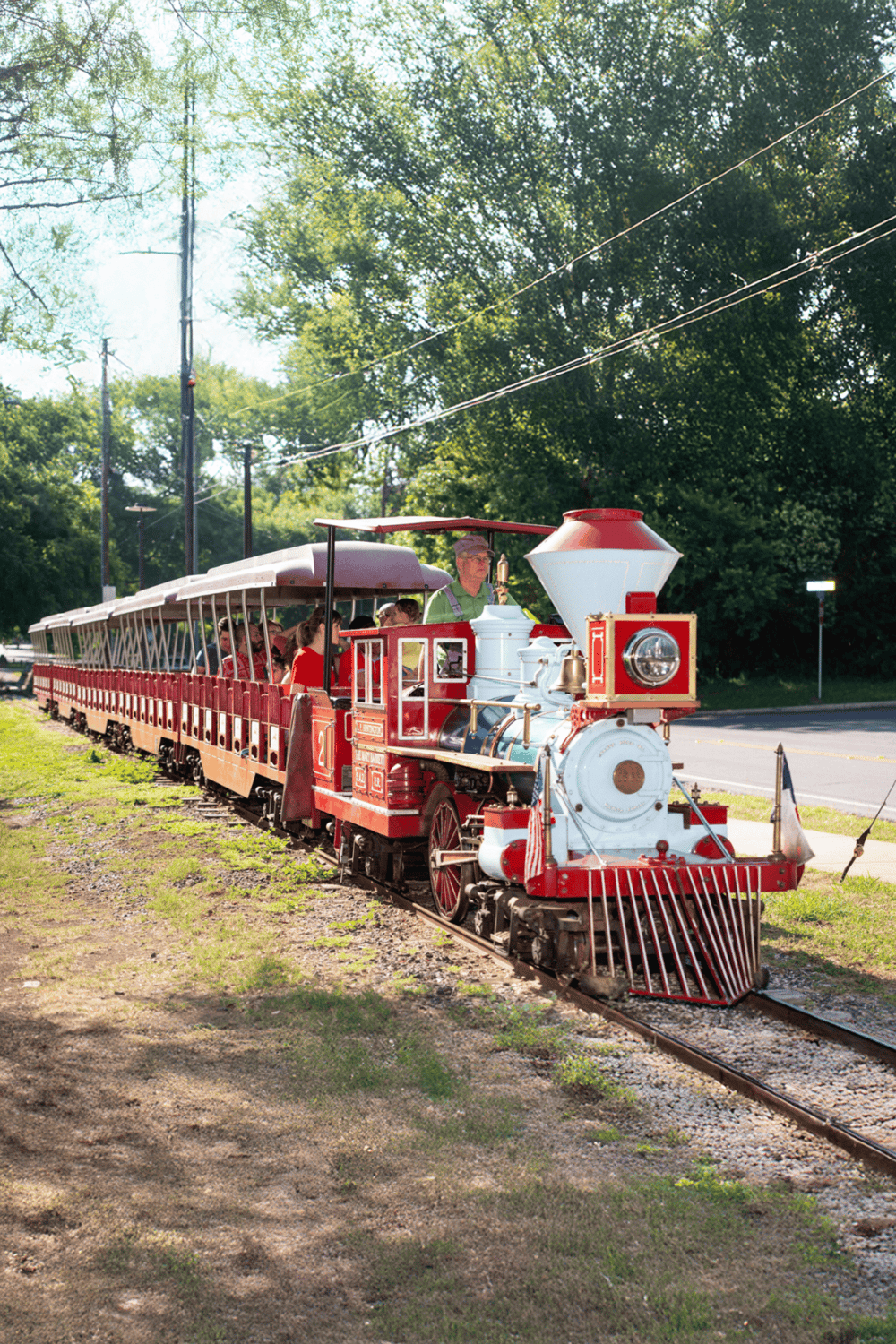 Miniature train ride at Quest for Directions outdoor attraction.