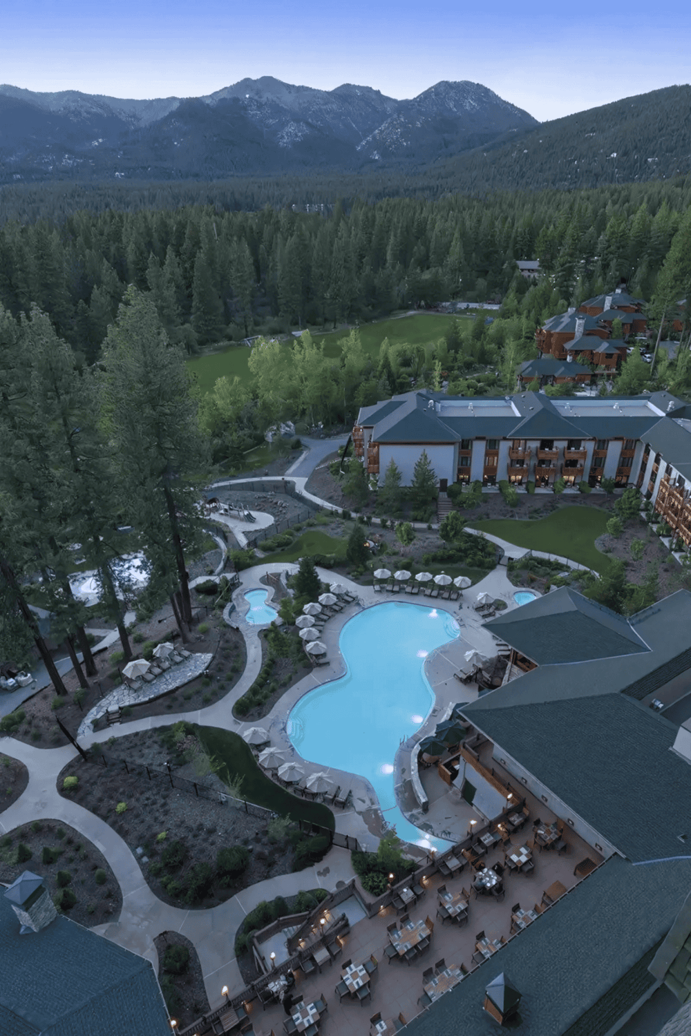 Luxurious resort with outdoor pool and mountain views, perfect for relaxing vacations.