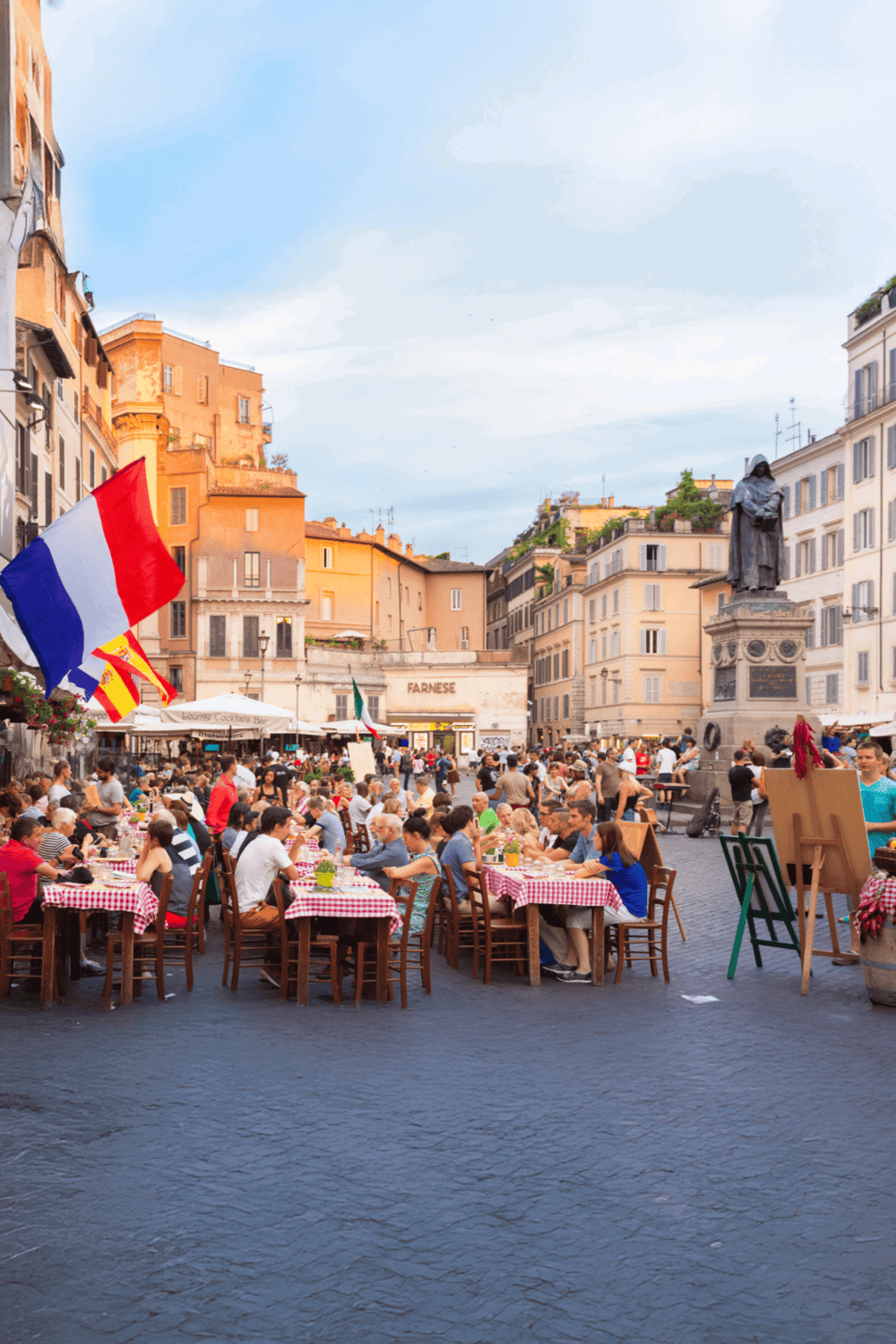 1. Outdoor café in Rome with bustling crowd and historic architecture, vibrant city life.