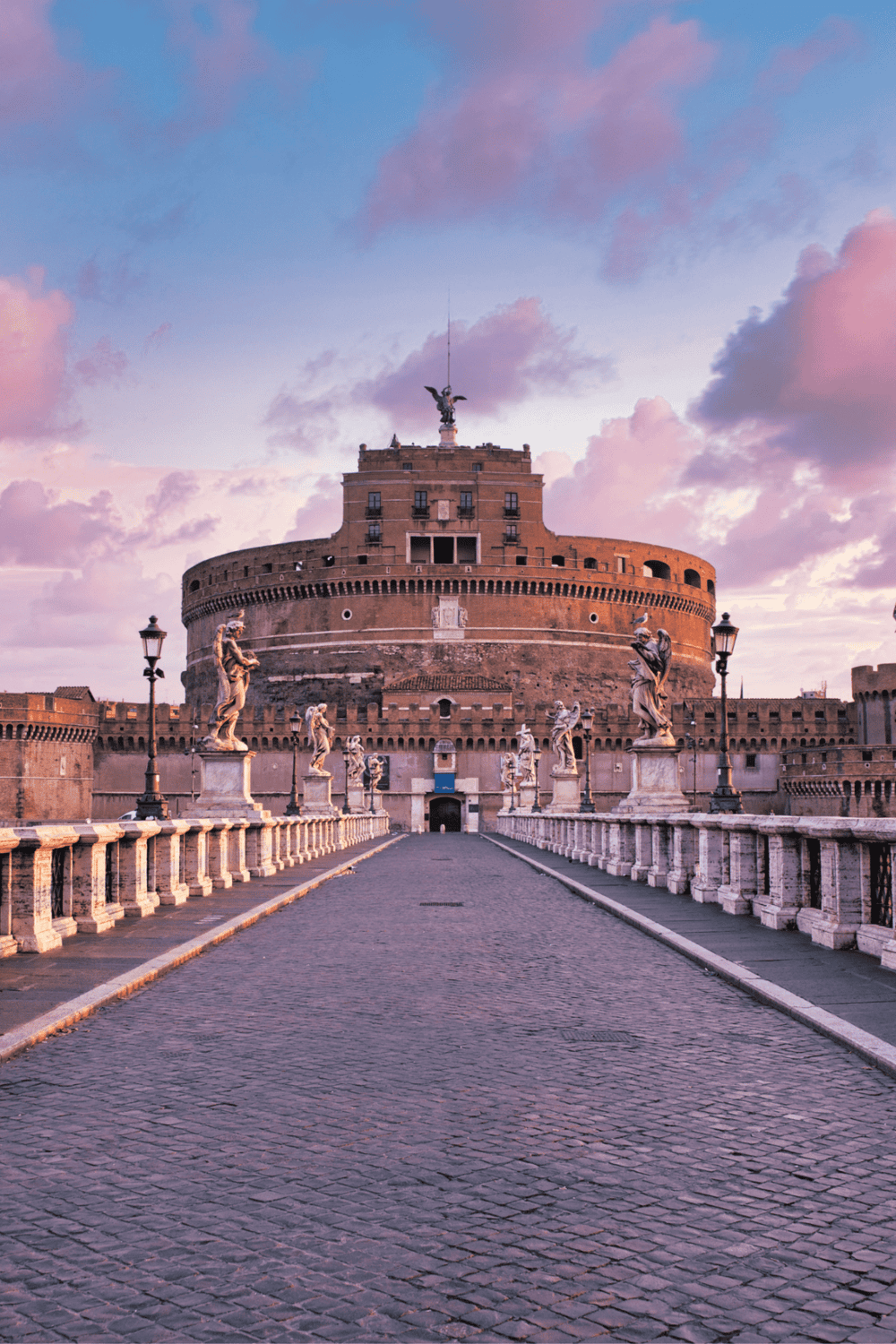 Ancient Rome's Castel Sant'Angelo at sunset, a historic landmark in Rome, Italy.