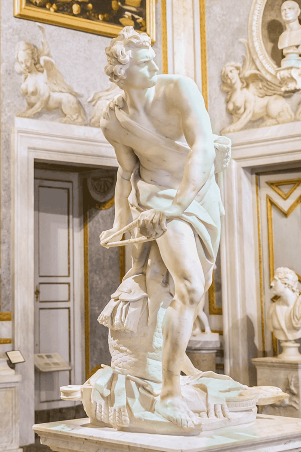 Majestic marble Greek sculpture of Hercules, highlighting classic sculptures and museum art displays.