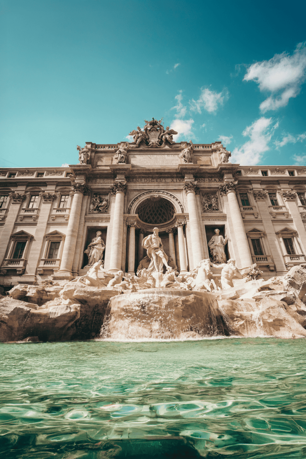 Ancient Roman style fountain in Rome, Italy, showcasing classical architecture and sculptures.