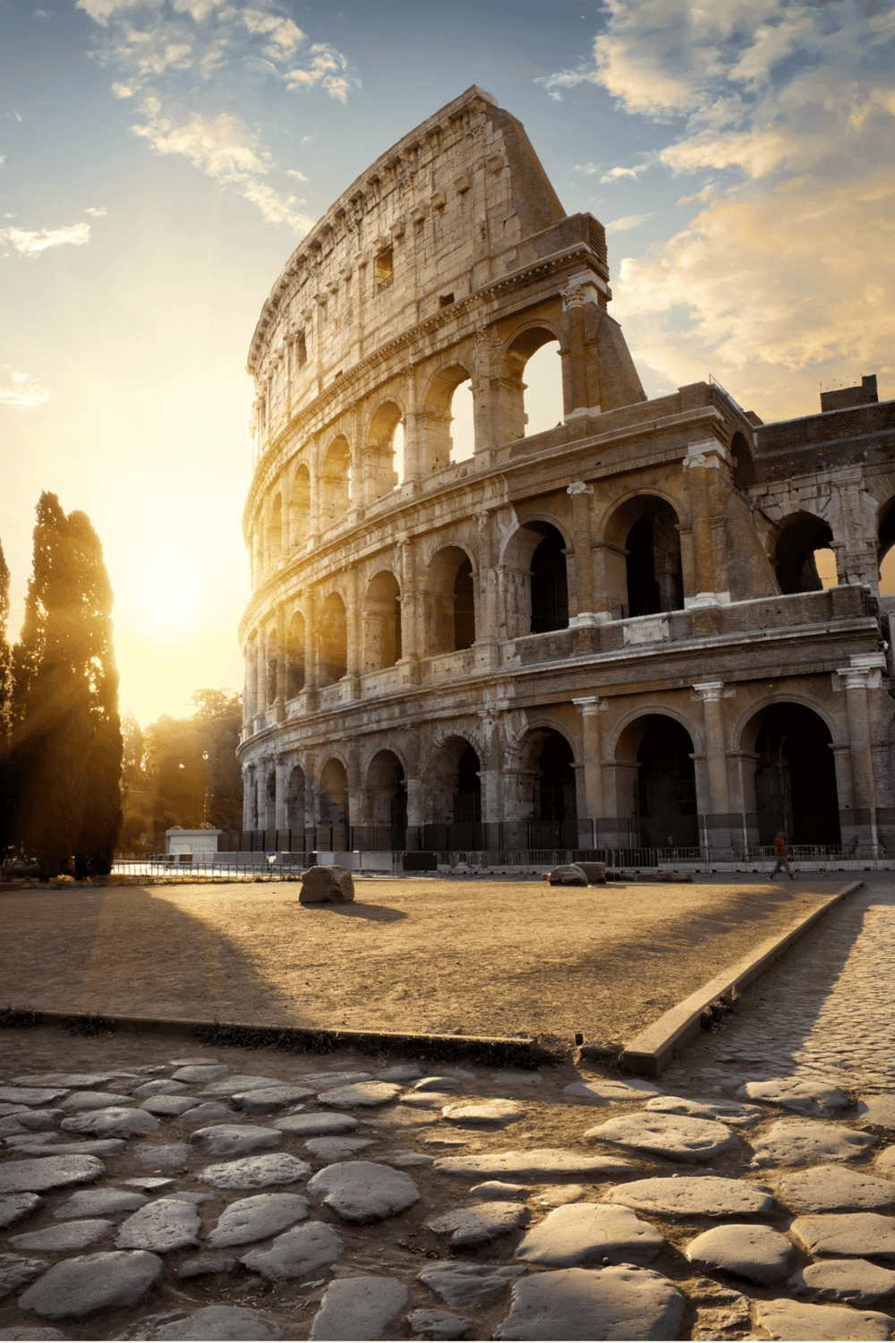 Ancient Roman Colosseum in Rome at sunset, iconic historical landmark and popular tourist attraction.
