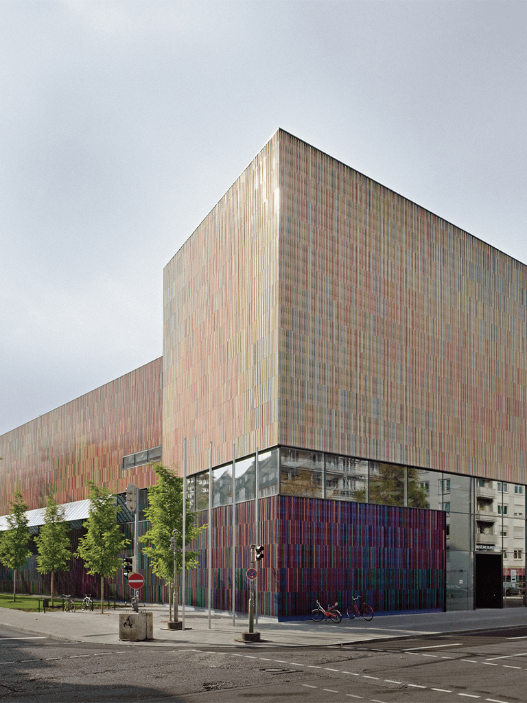 Bright modern architectural building with colorful facade for QuestForDirections SEO.