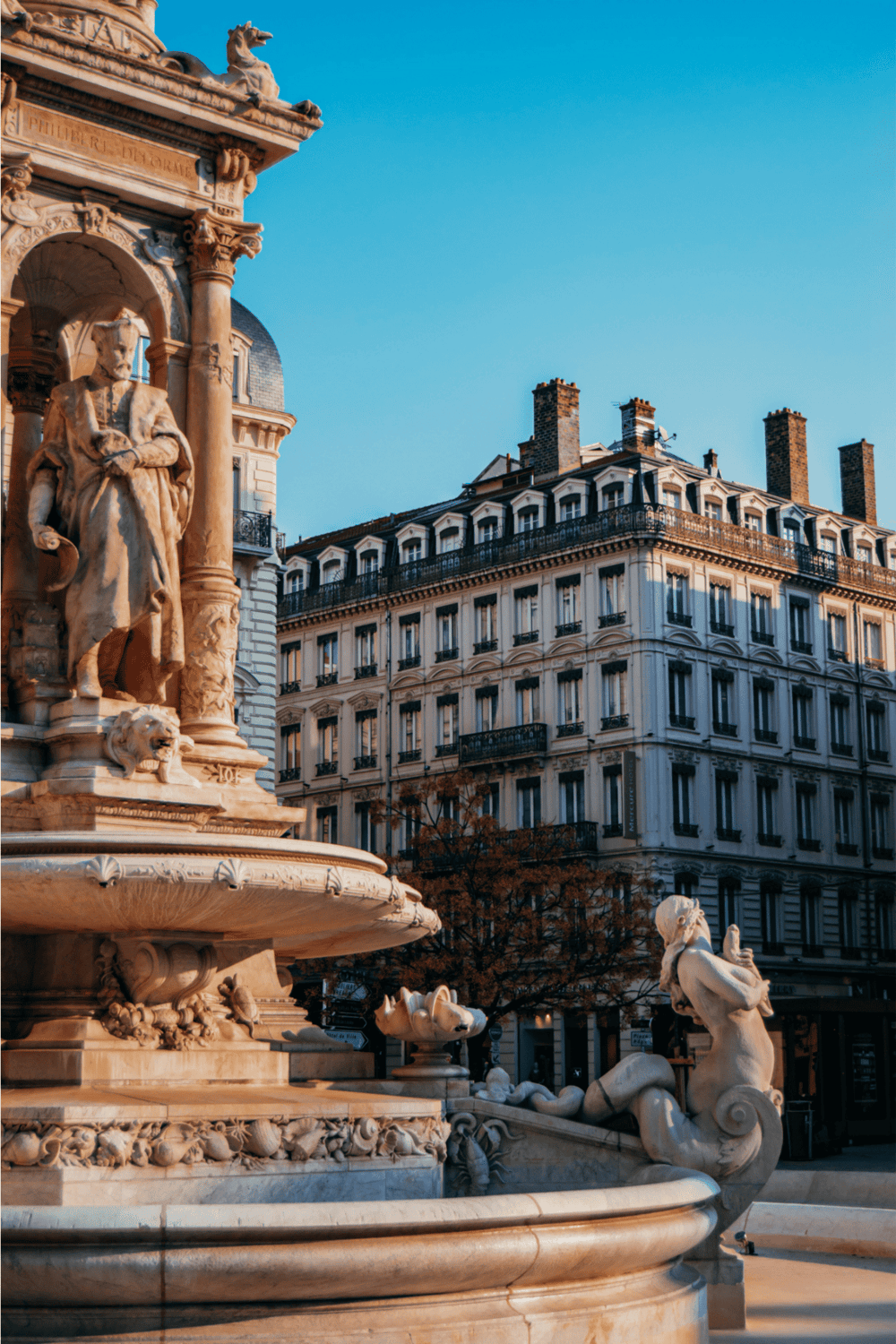 Ornate Paris fountain sculpture with historic architecture, highlighting Paris sightseeing and travel destinations.