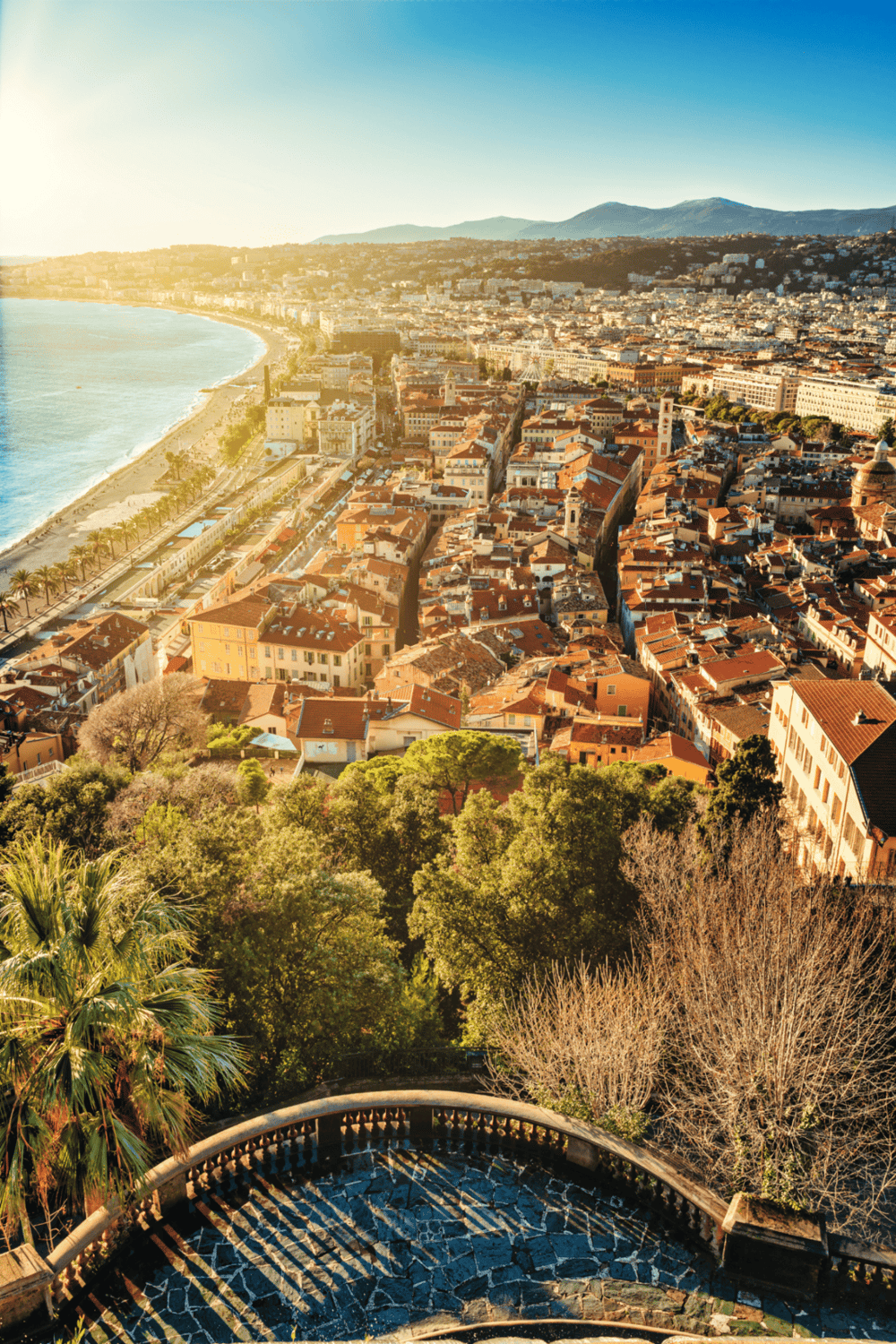 Vibrant aerial view of Nice, France coastal city with historic architecture and scenic Mediterranean coastline.
