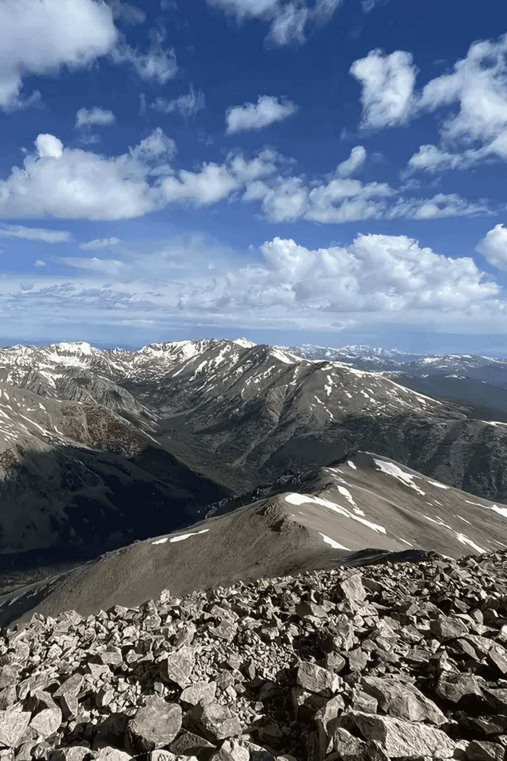 Breathtaking mountain landscape with snow-capped peaks under a vibrant blue sky. Perfect for adventure and travel enthusiasts exploring nature.
